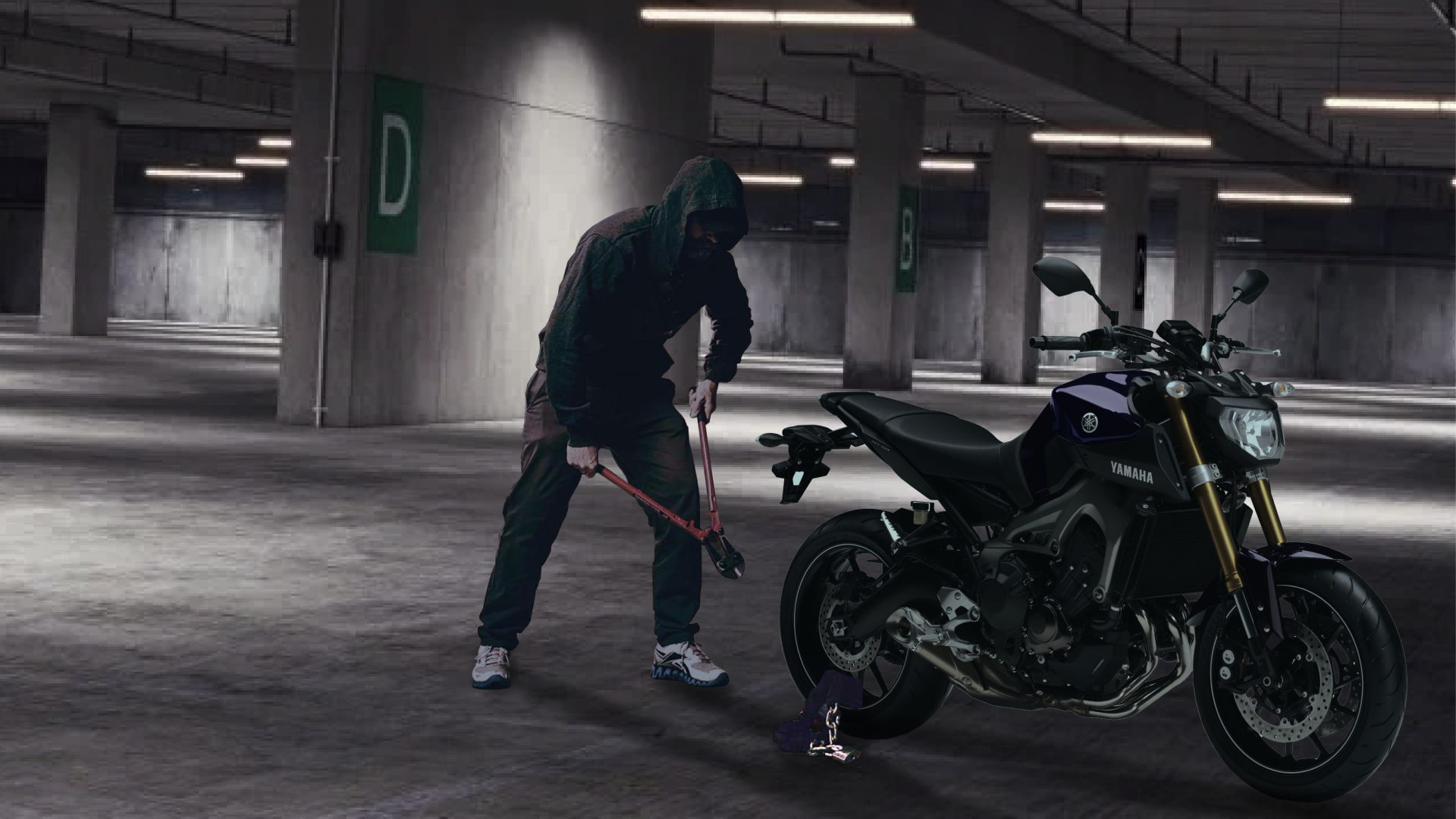 Homme cagoulé qui vole une moto